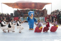 students form forestry college dancing in conservation song in owl festival 